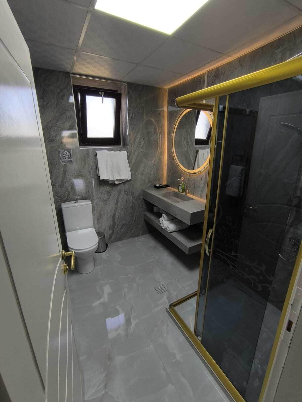 quadruple room | bathroom | hair dryer, slippers, towels