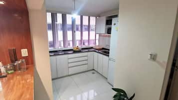 Superior Apartment | Private kitchen | Oven, rice cooker, cookware/dishes/utensils, freezer