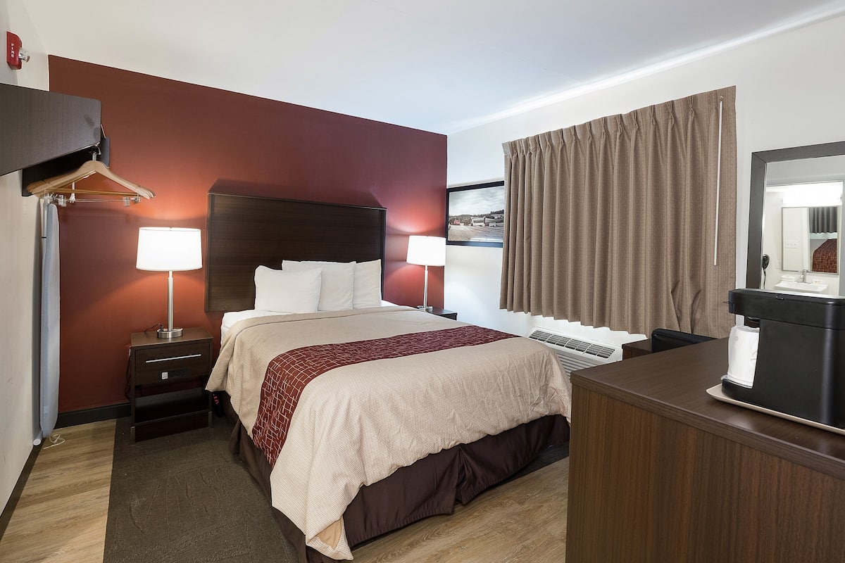 Desk, blackout drapes, iron/ironing board, rollaway beds