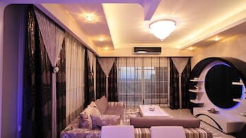 Apartment, 2 Bedrooms | Living area | Flat-screen TV, pay films