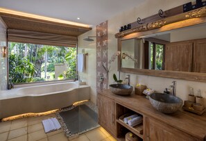 Deluxe Pool Villa | Bathroom | Separate bathtub and shower, free toiletries, hair dryer, slippers - The Sankara Resort & Spa (Ubud)