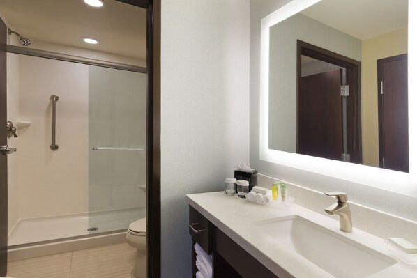 A modern bathroom with a glass shower enclosure, a white sink, and a large mirror. - Homewood Suites by Hilton Mobile I-65/Airport Blvd, AL (Mobile)