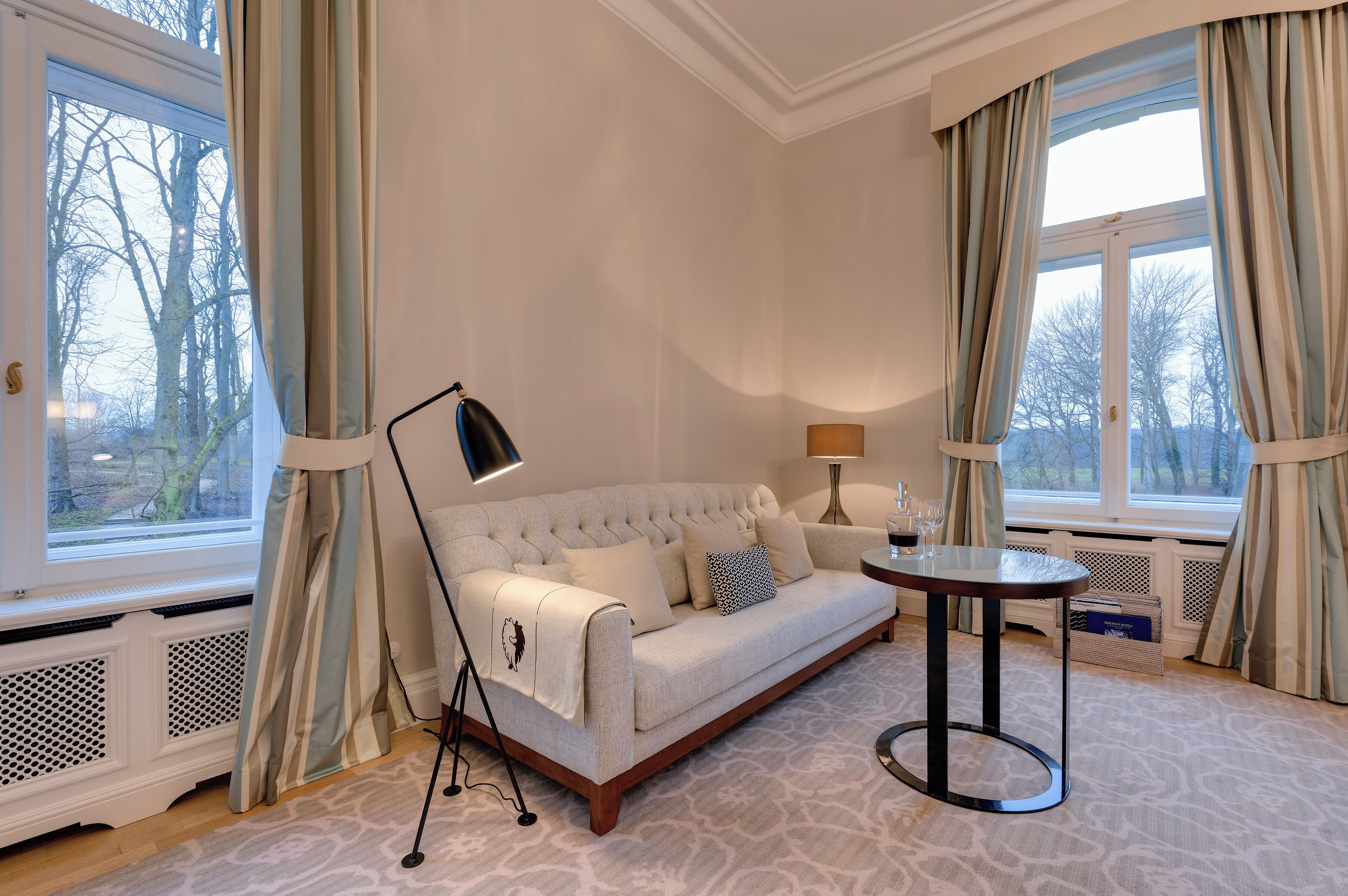 premium room (in the castle) | living area | 48-inch flat-screen tv with digital channels, tv, books