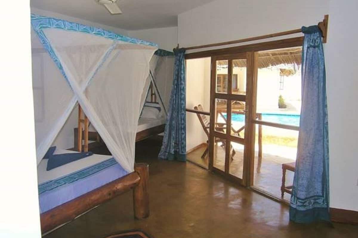 Standard Triple Room, Patio, Pool View | In-room safe, WiFi (free), individually decorated