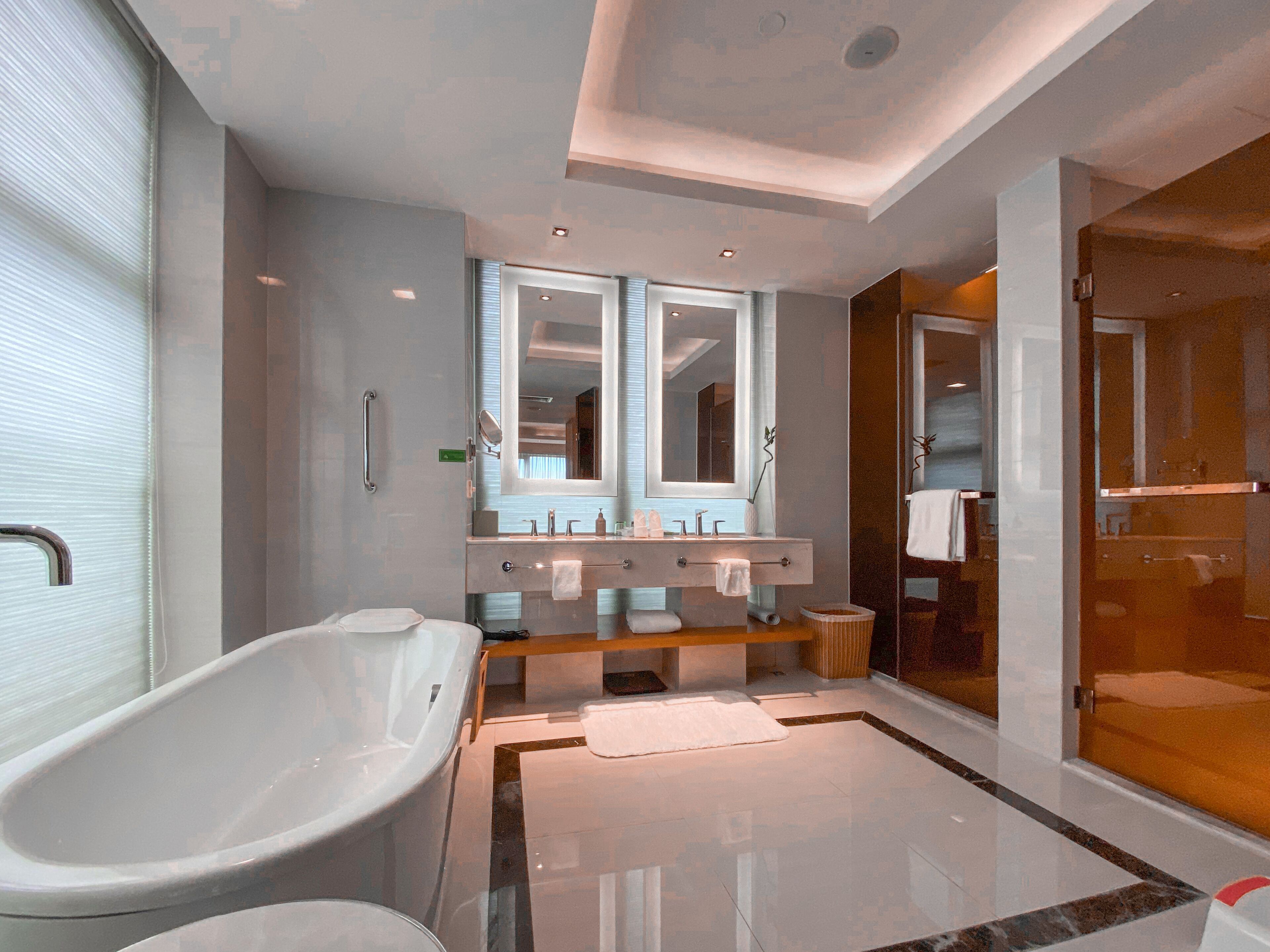 superior suite | bathroom | rainfall showerhead, hair dryer, slippers, towels