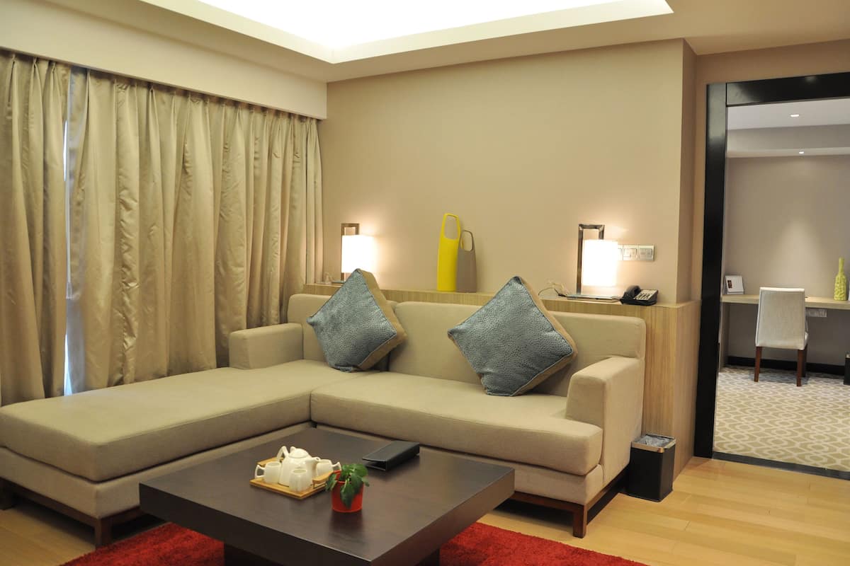Deluxe Suite, 1 Bedroom | Living area | LCD TV