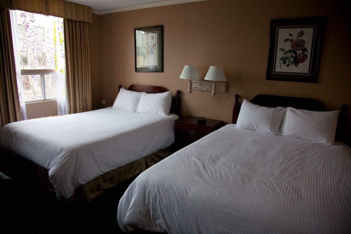 Premium bedding, down comforters, desk, laptop workspace