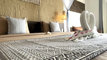 Down comforters, memory foam beds, in-room safe, desk