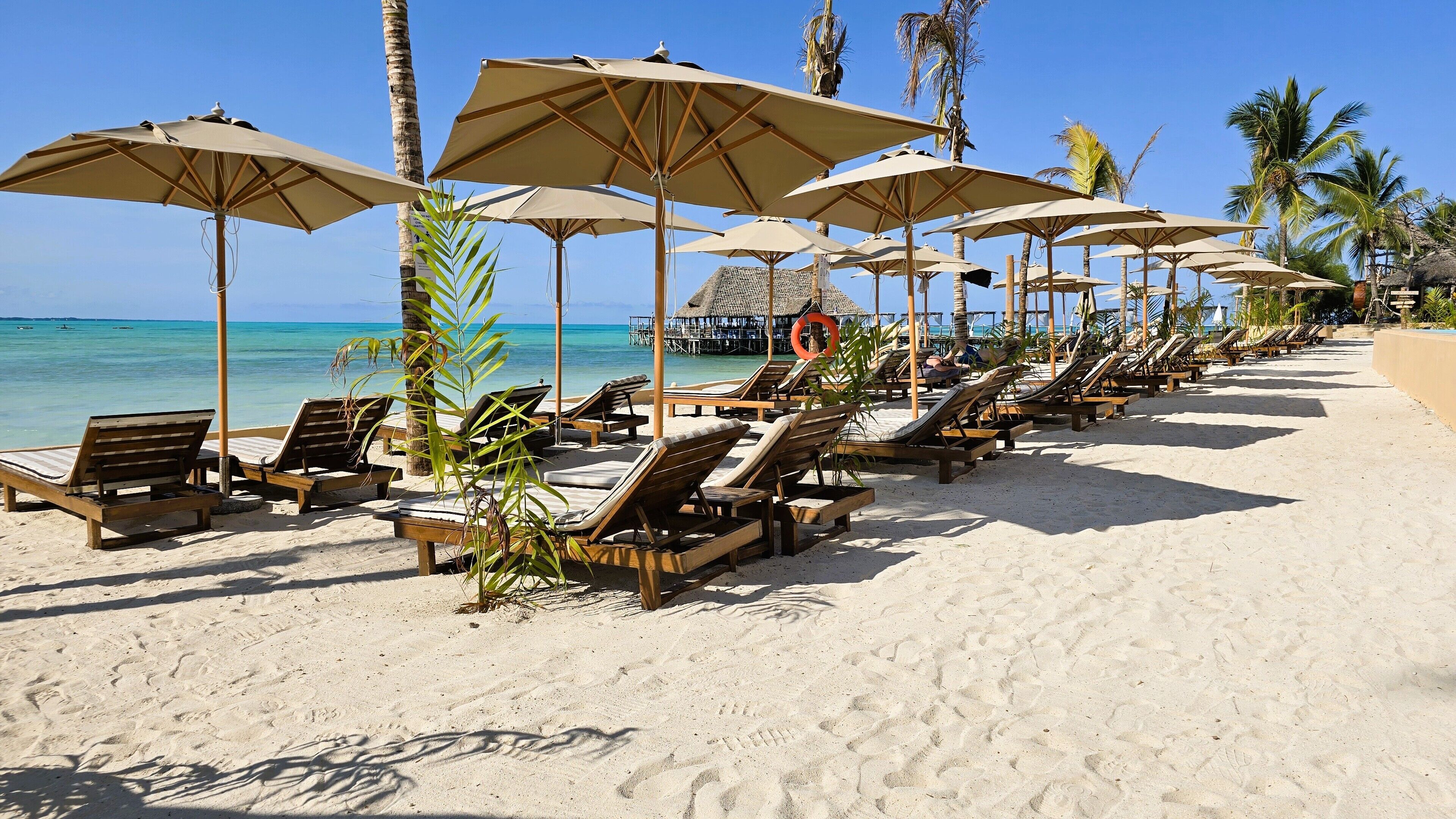 Private beach, white sand, sun-loungers, beach umbrellas