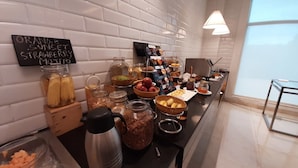A breakfast buffet with various food items and condiments. - Fairfield by Marriott Pune Kharadi (Pune)