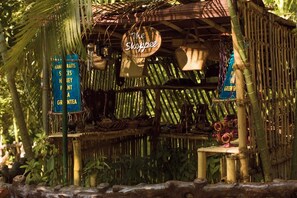A rustic bamboo structure with a sign reading "The Shoppee." - Crescent Residency (Sulthan Bathery)