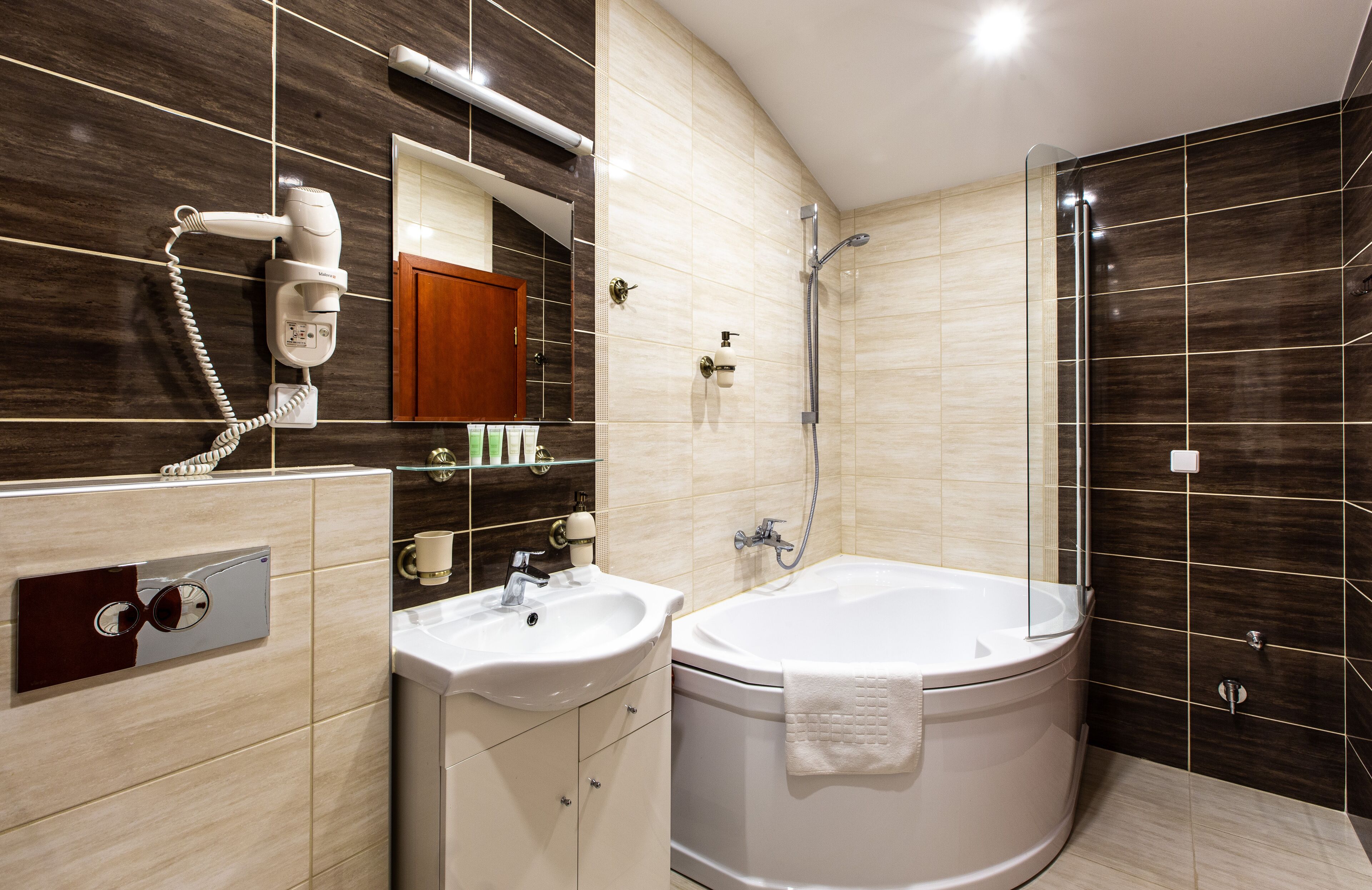 luxury apartment | bathroom | bathtub, deep-soaking bathtub, free toiletries, hair dryer