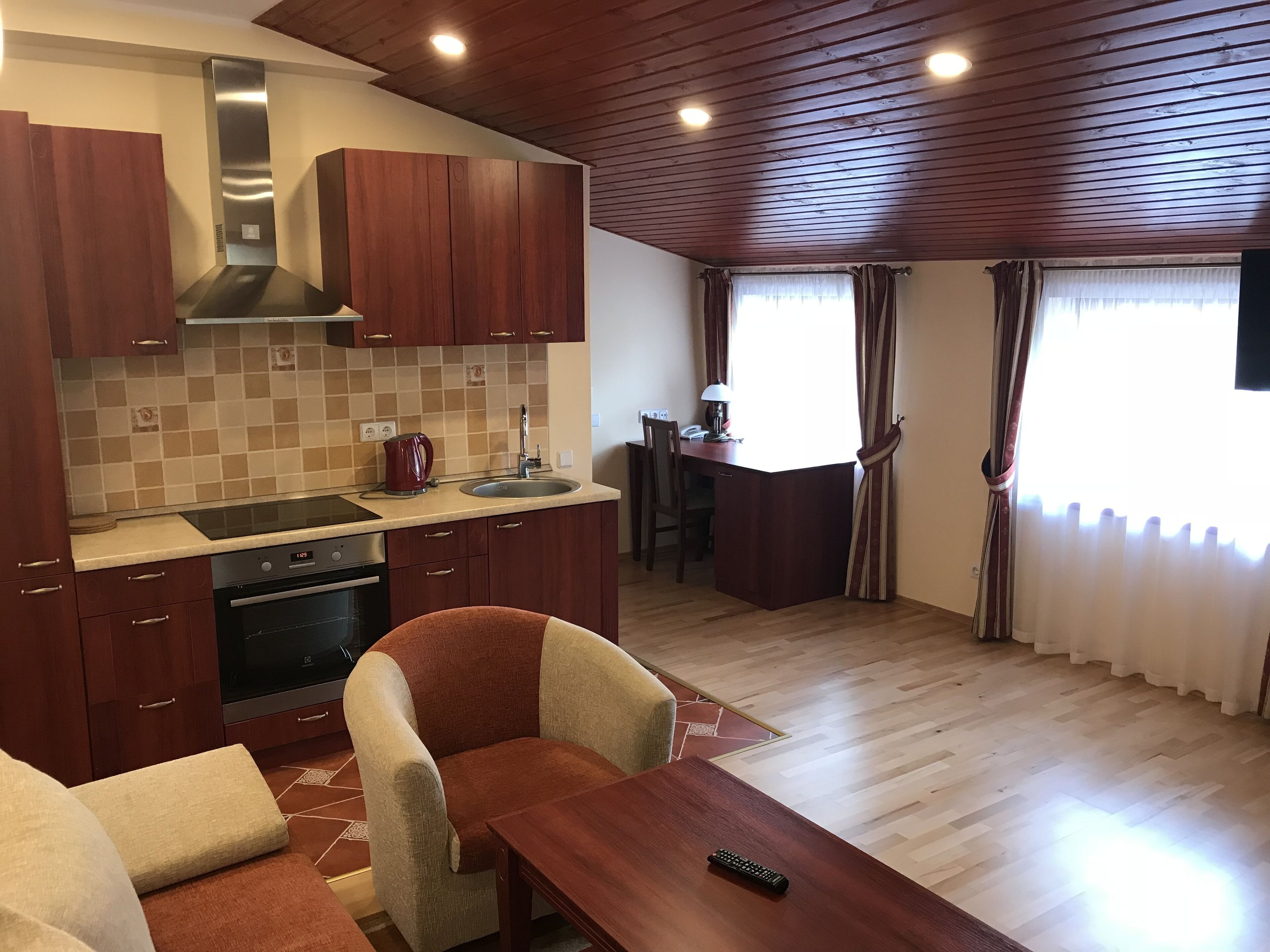 family apartment | living room | 40-inch flat-screen tv with cable channels, tv, heated floors