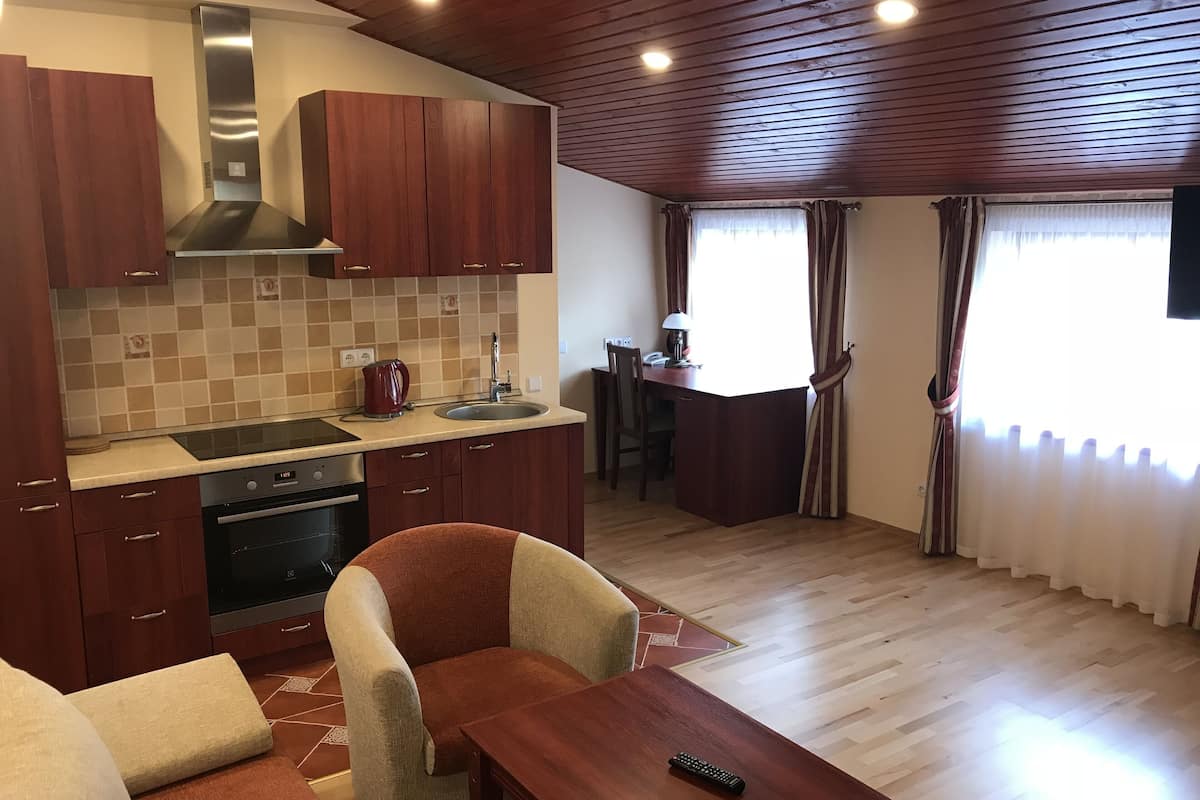 family apartment | living room | 40-inch flat-screen tv with cable channels, tv, heated floors