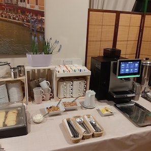 A breakfast buffet setup with various food items, a coffee machine, and a sign indicating 'London Prestige'. - Hotel Gaja (Ozarow Mazowiecki)