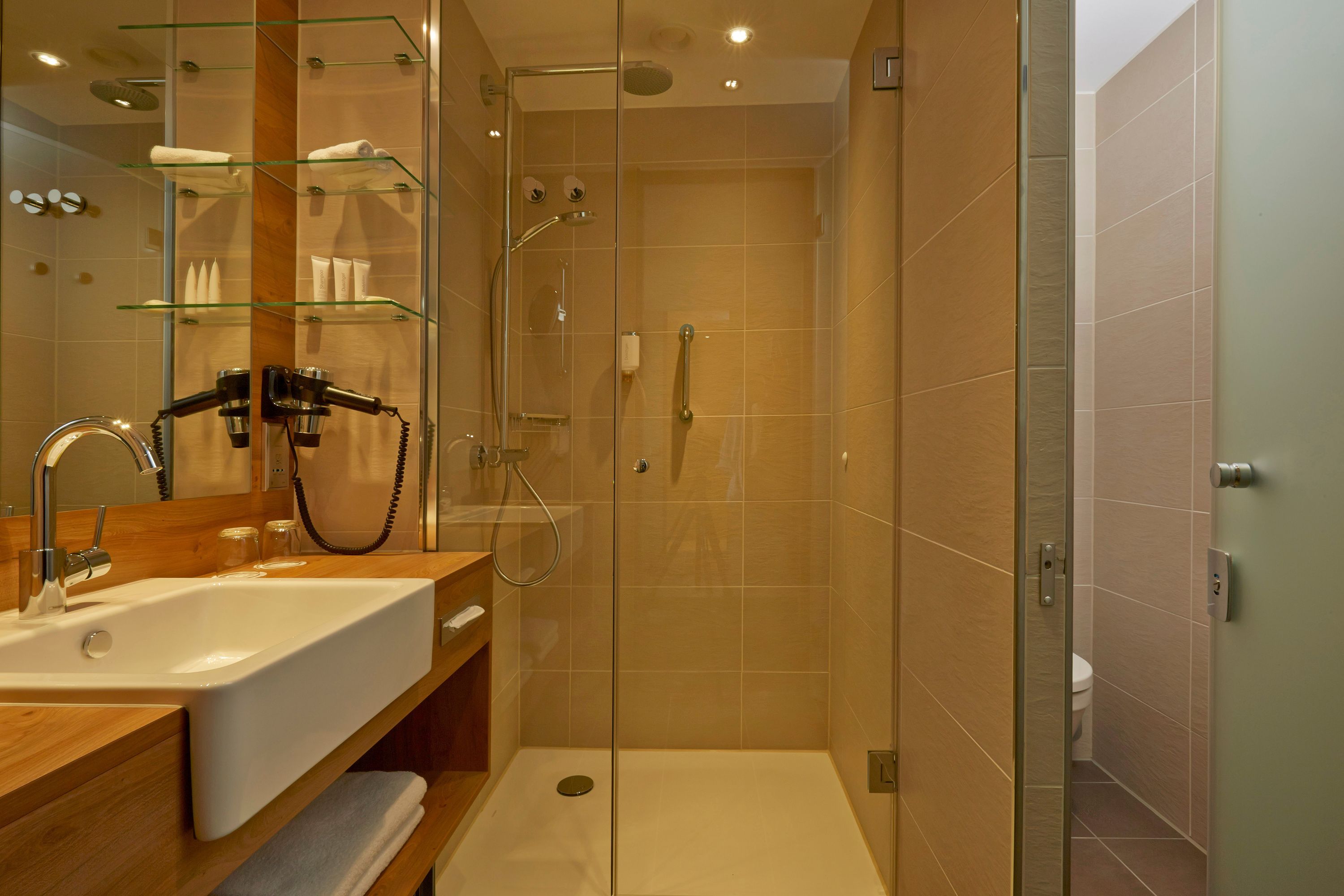 shower, rainfall showerhead, hair dryer, towels