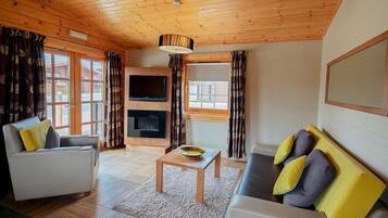 Luxury 3-bed lodge with hot tub | Living area | Flat-screen TV