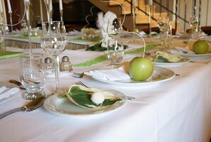 A table set for a meal with plates, cutlery, and glasses. - Hotel Grodzki (Poznań)