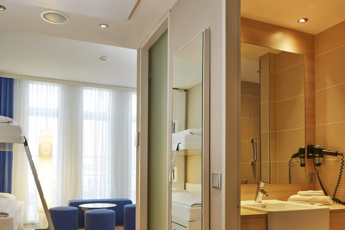 Hypo-allergenic bedding, desk, blackout drapes, soundproofing