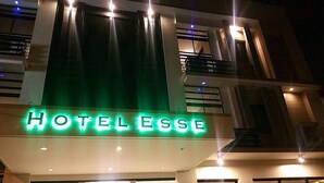 A hotel sign with the name "HOTEL L'ESSE" illuminated in green lights. - Hotel Esse Davao (Davao)