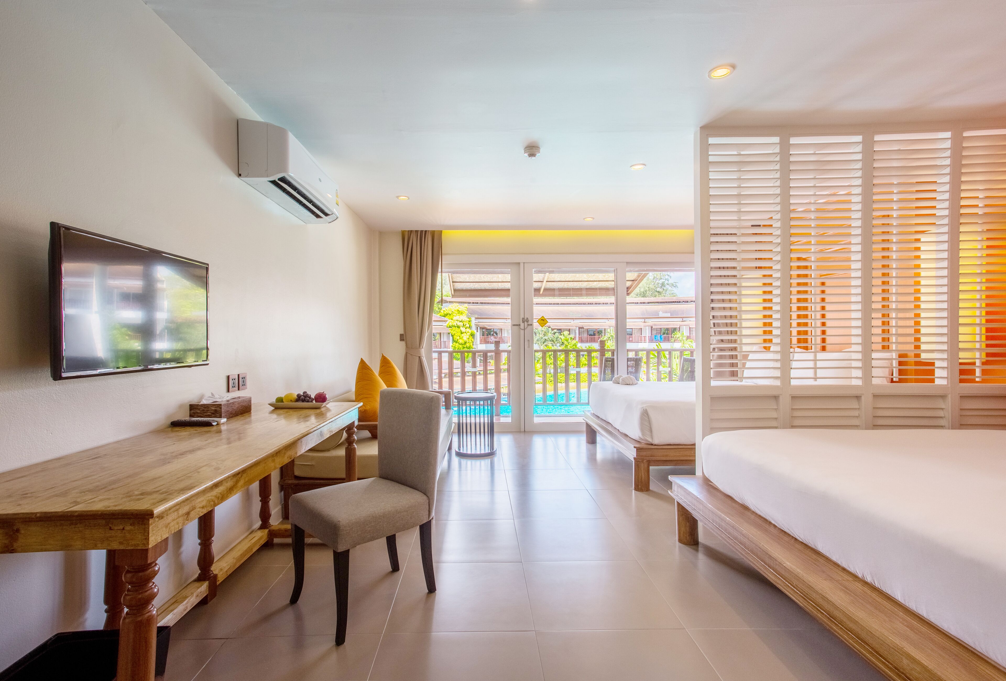 grand deluxe pool view | 1 bedroom, in-room safe, laptop workspace, iron/ironing board