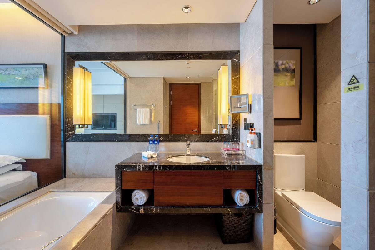 standard room (upgraded) | bathroom | separate bathtub and shower, free toiletries, hair dryer, bathrobes