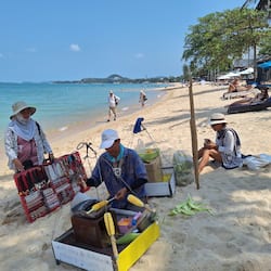 On the beach, white sand, sun-loungers