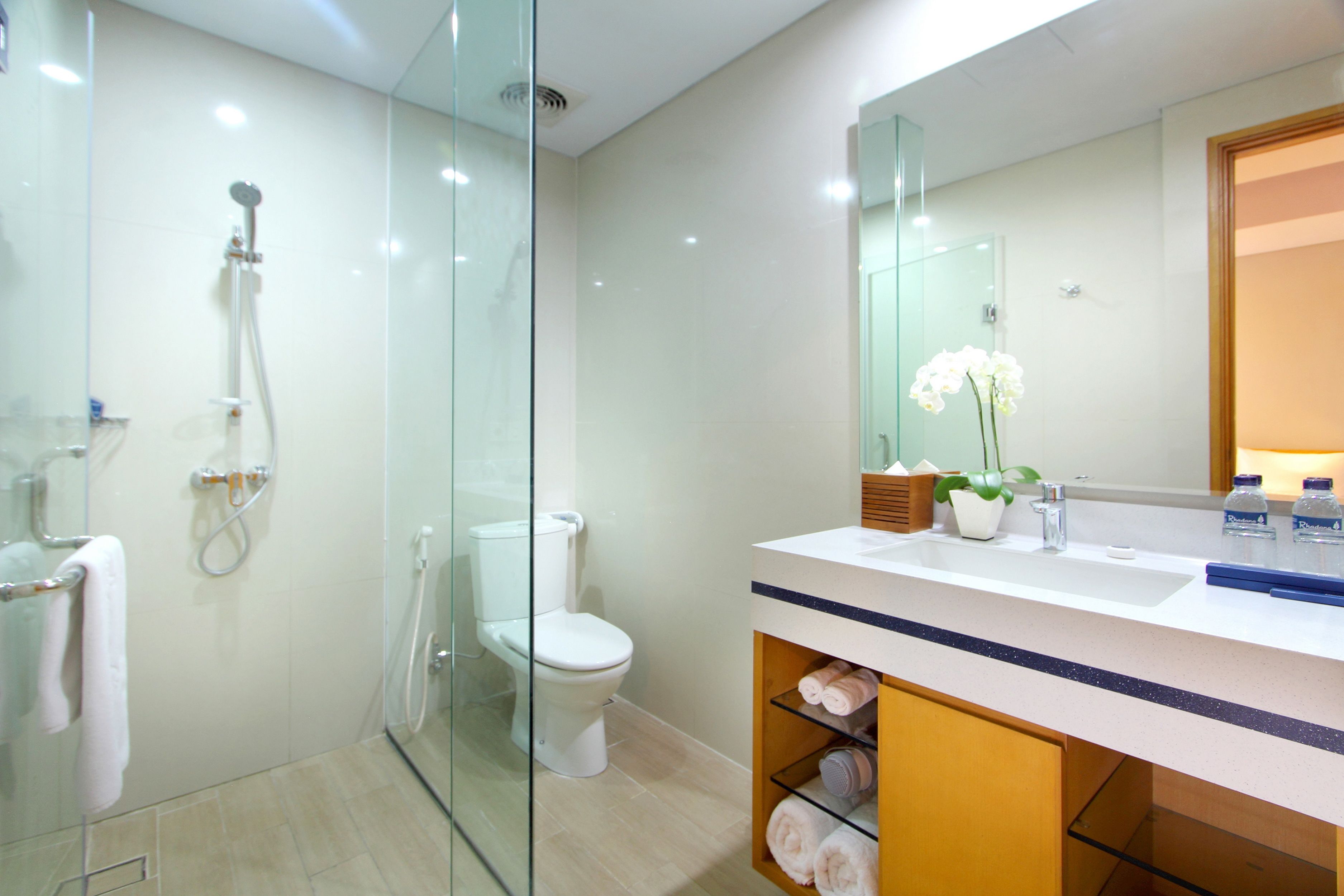 shower, hair dryer, slippers, towels