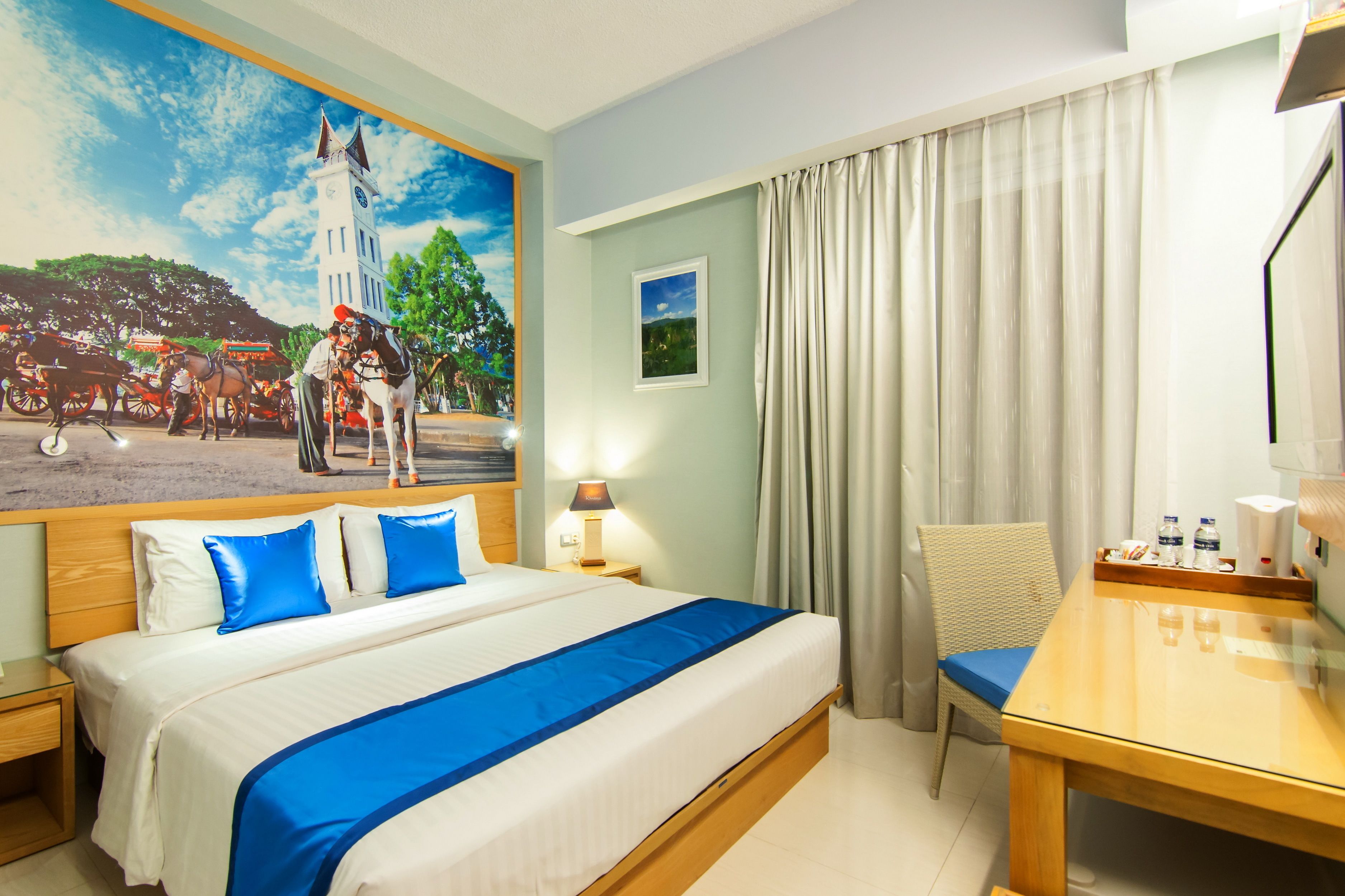 premium double room, balcony | in-room safe, individually decorated, desk, iron/ironing board