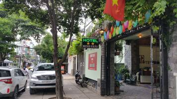 Minh Chau hotel offers a convenient street entrance with a welcoming outdoor seating area.