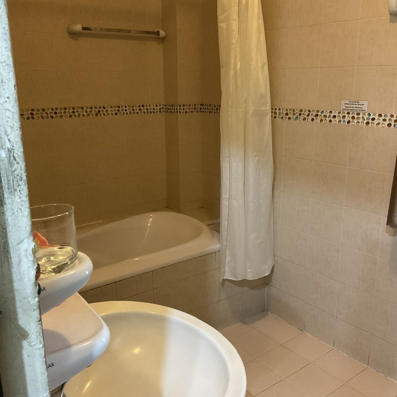 deluxe room, 2 queen beds | bathroom | free toiletries, slippers, towels, soap