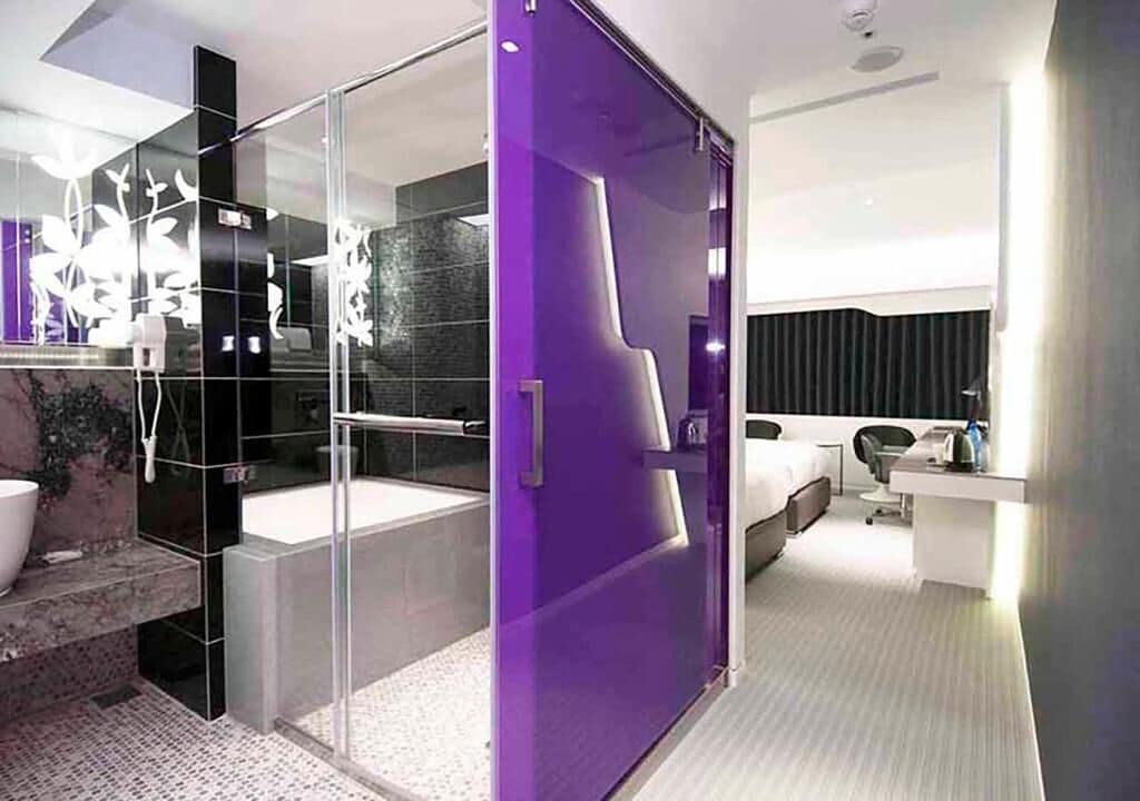 separate bathtub and shower, hair dryer, slippers, towels