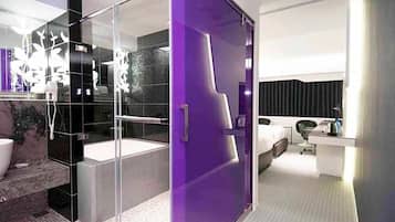 Separate tub and shower, hair dryer, slippers, towels