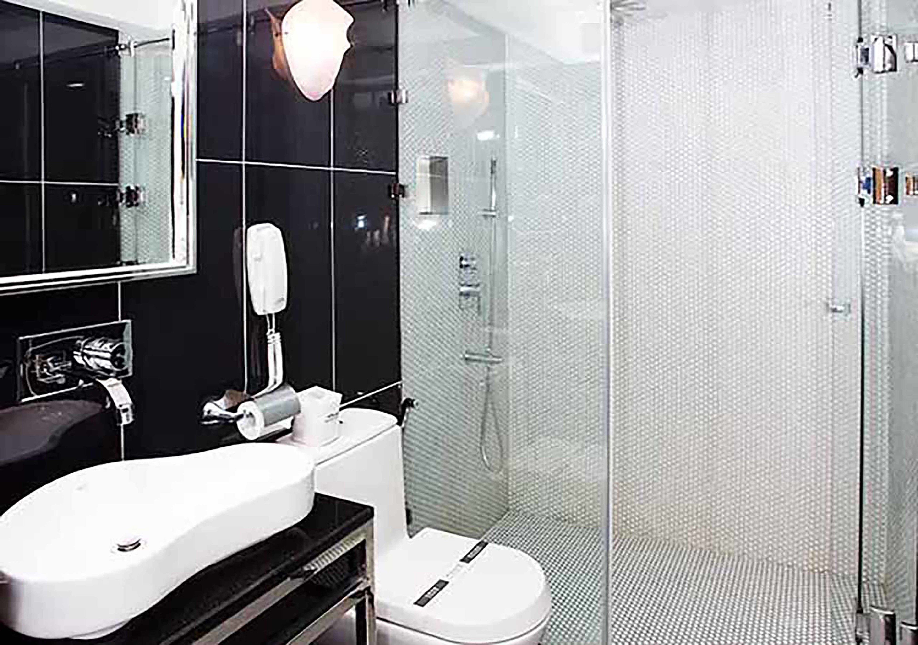 shower, hair dryer, slippers, towels