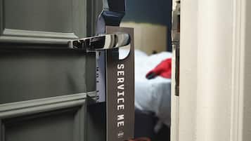A door with a sign that reads "SERVICE ME" and the year "1852".