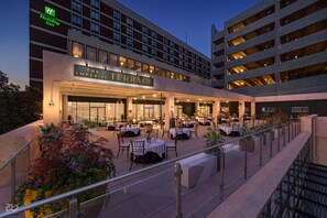 A hotel exterior with a terrace dining area, outdoor seating, and a sign for "The Imperial Terrace". - Holiday Inn Lancaster by IHG (Lancaster)