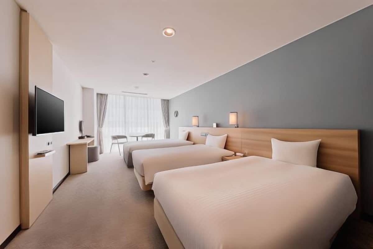 Premium bedding, down duvets, desk, laptop workspace