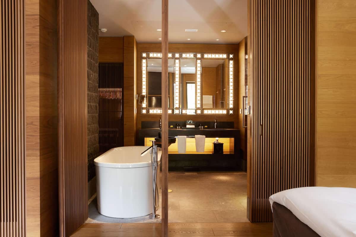 deluxe room (grand) | bathroom | separate bathtub and shower, deep-soaking bathtub, rainfall showerhead
