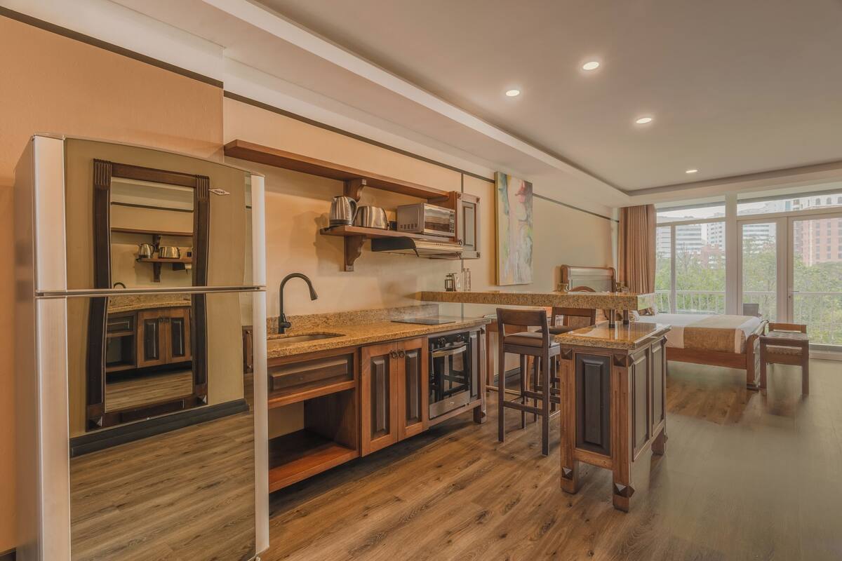 superior suite, balcony | private kitchen | full-sized fridge, microwave, oven, stovetop