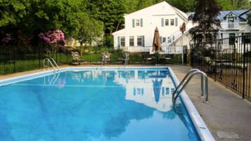 Seasonal outdoor pool, open 7:00 AM to 8:00 PM, pool umbrellas