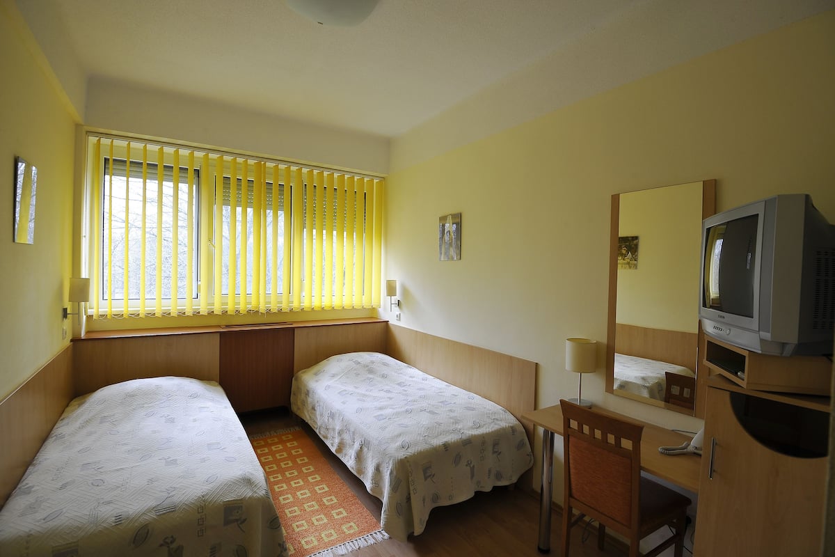 twin room, 2 single beds | in-room safe, desk, free cots/infant beds, rollaway beds