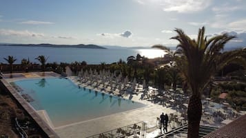 Indoor pool, outdoor pool, pool umbrellas, pool loungers