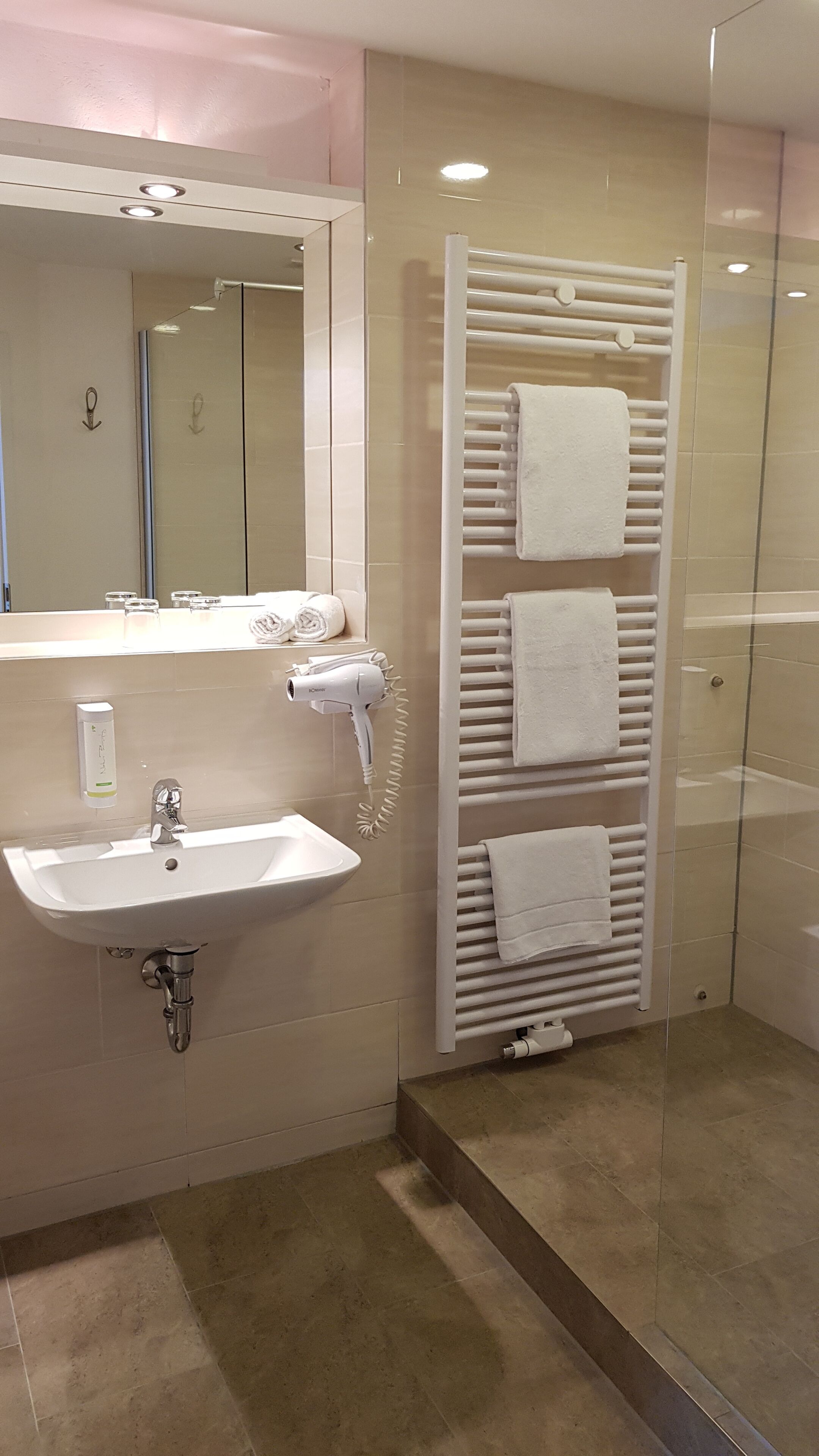 deep-soaking bathtub, hair dryer, towels