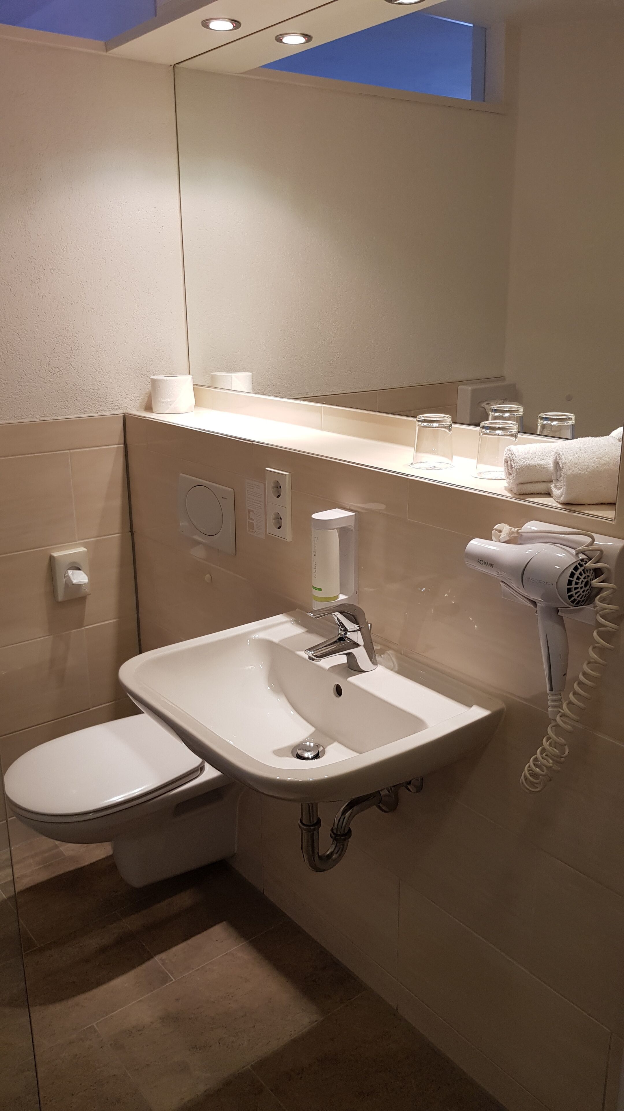 deep-soaking bathtub, hair dryer, towels