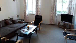 Comfort appartement | Woonruimte | Flatscreentelevisie