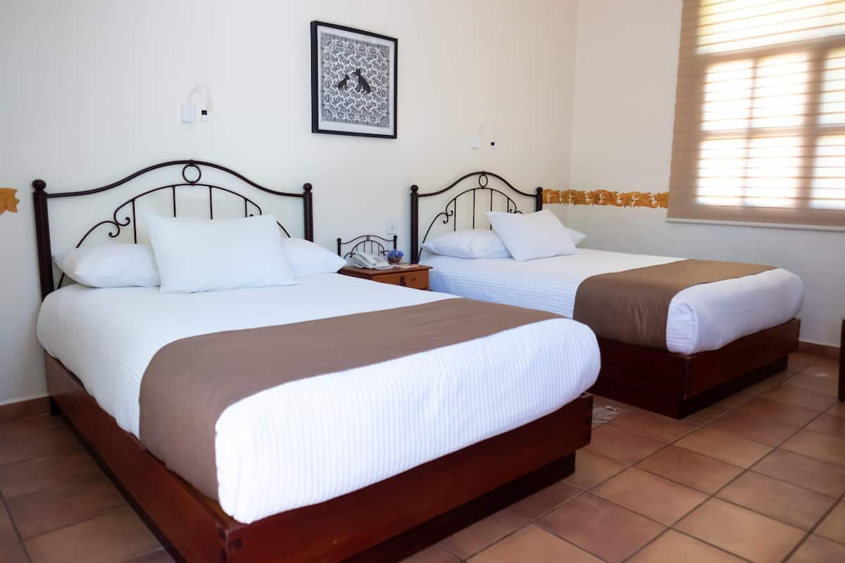 Premium bedding, blackout drapes, iron/ironing board (on request)
