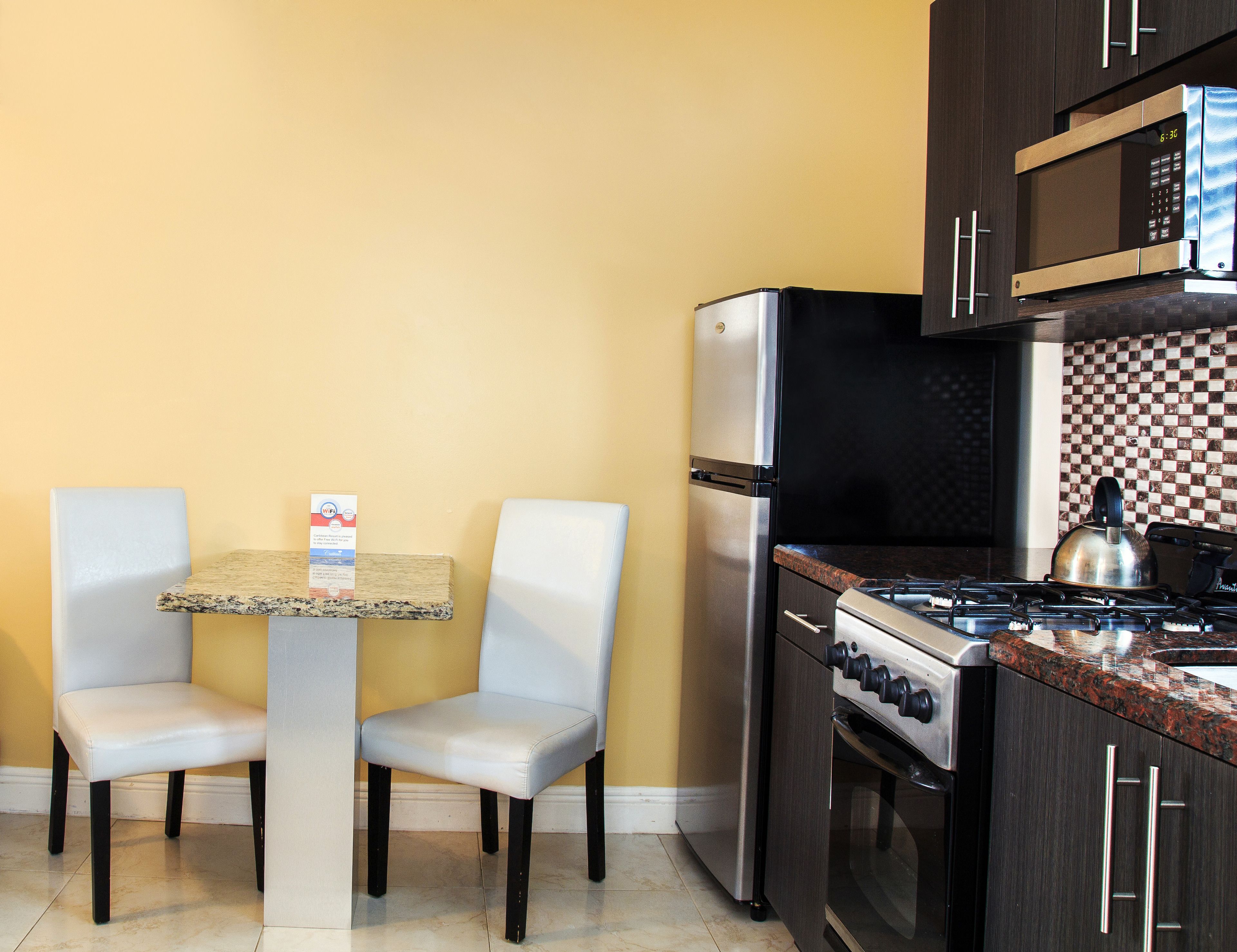king studio: 1 king bed  | private kitchen | full-sized fridge, microwave, stovetop, cookware/dishes/utensils