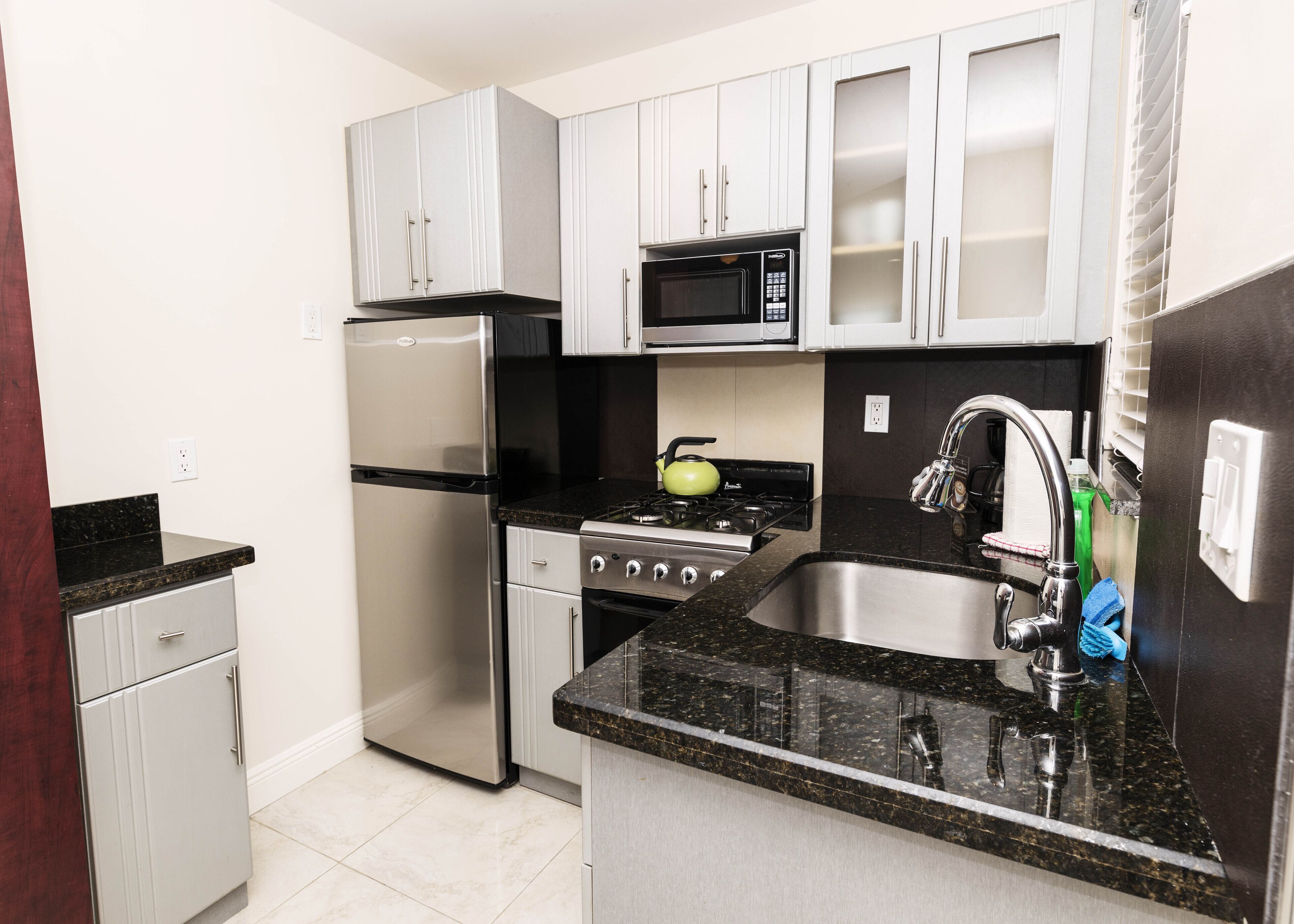 exclusive studio suite | private kitchenette | full-sized fridge, microwave, stovetop, cookware/dishes/utensils