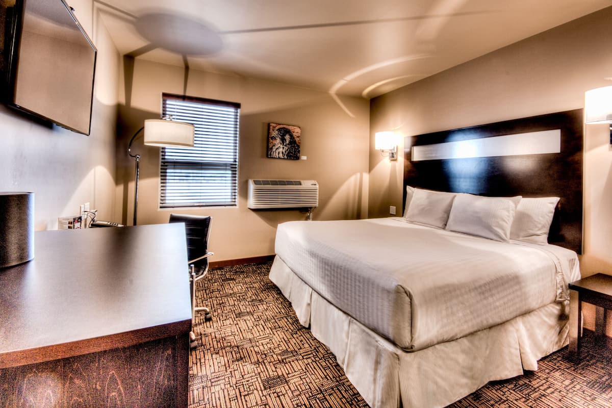 king bachelor full bathroom  | premium bedding, down duvets, pillow-top beds, desk