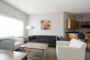 2 Bedroom Suite, Kitchen with Living room | Living area | Flat-screen TV, fireplace - Premier Residences (Fort McMurray)